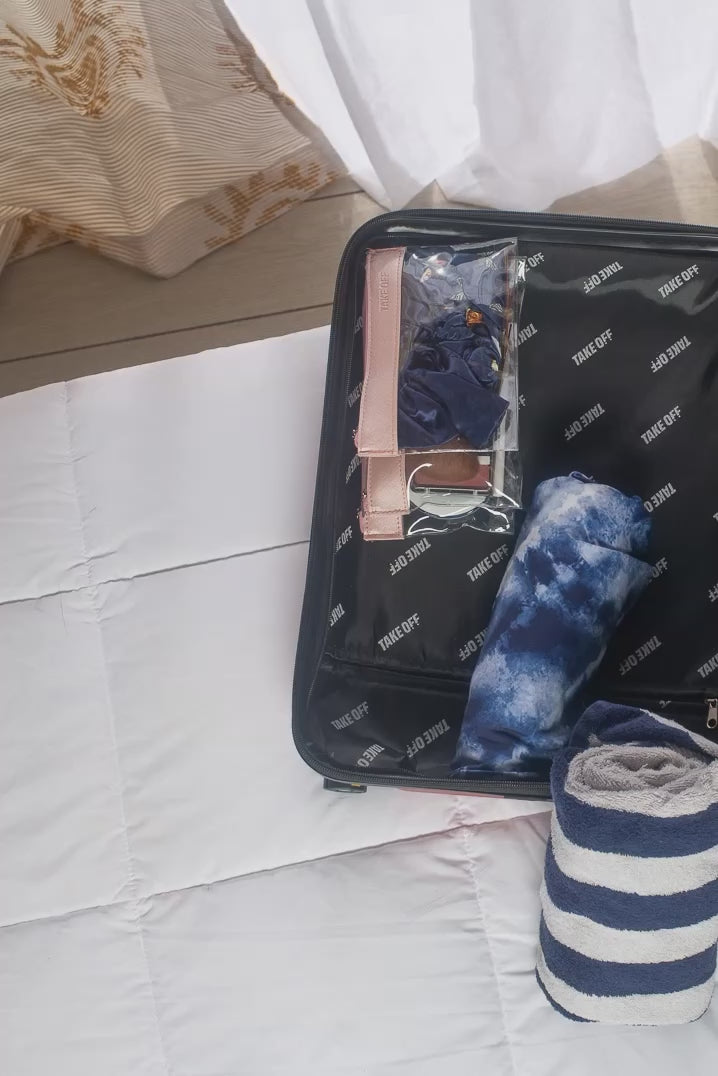 A stop motion video showing the Take OFF Luggage being packed, and two shoes placed in the Take OFF Luggage Shoe Bag before being put into the Take OFF Suitcase